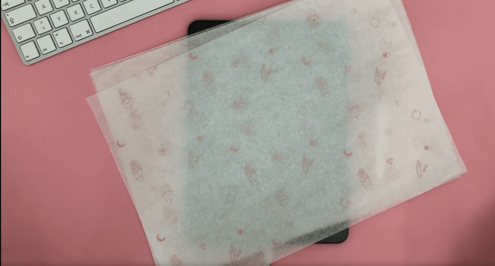 Silk paper with a printed pattern on a pink background. 