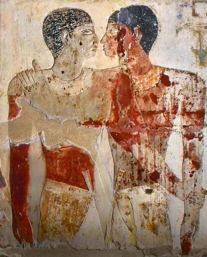 Two Egyptian men embracing.