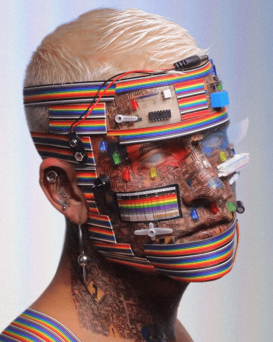 Young man with his face covered in stickers, plastic and various other items. 