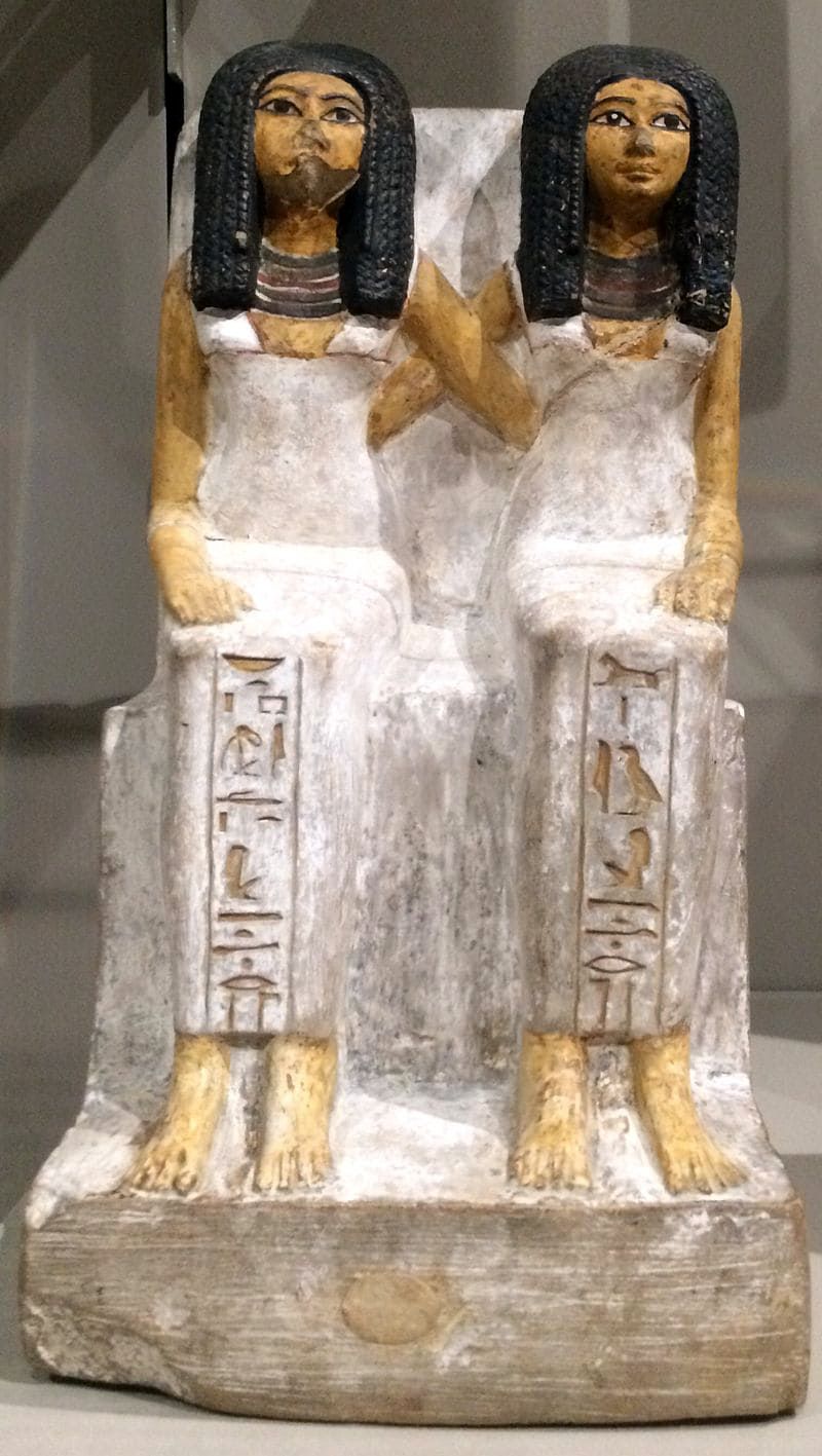 Sculpture of two Egyptian women embracing. 