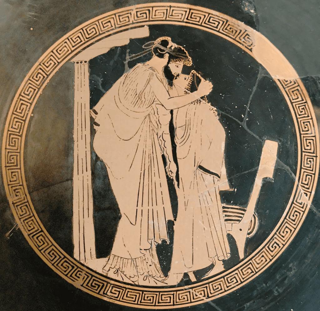 Two Greek men embracing