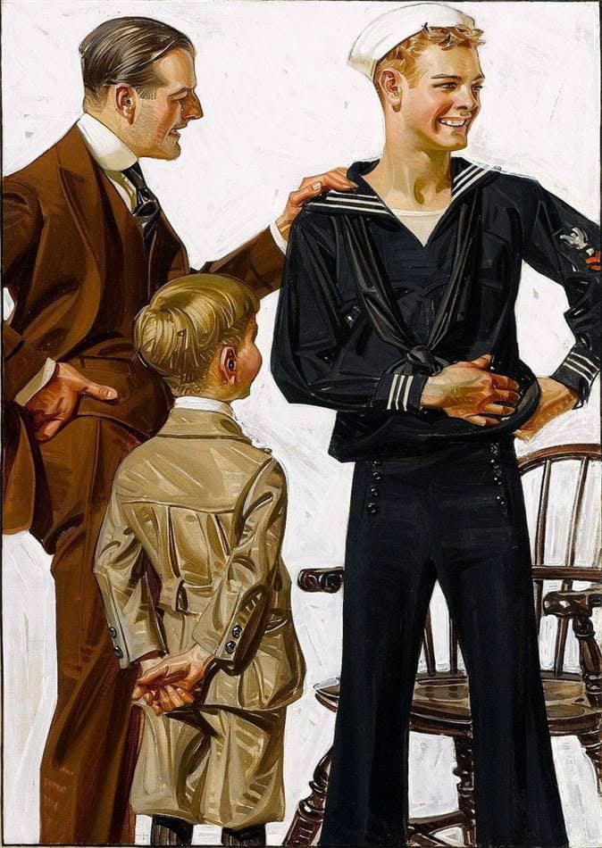 Two young men and a boy standing. 