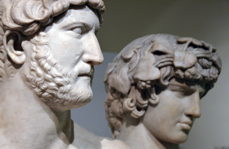 Heads of two marble sculptures depicting two Roman men. 