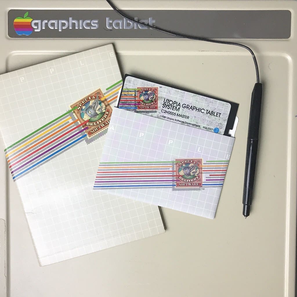 80s graphic tablet with rainbow paper and rainbow envelope on top