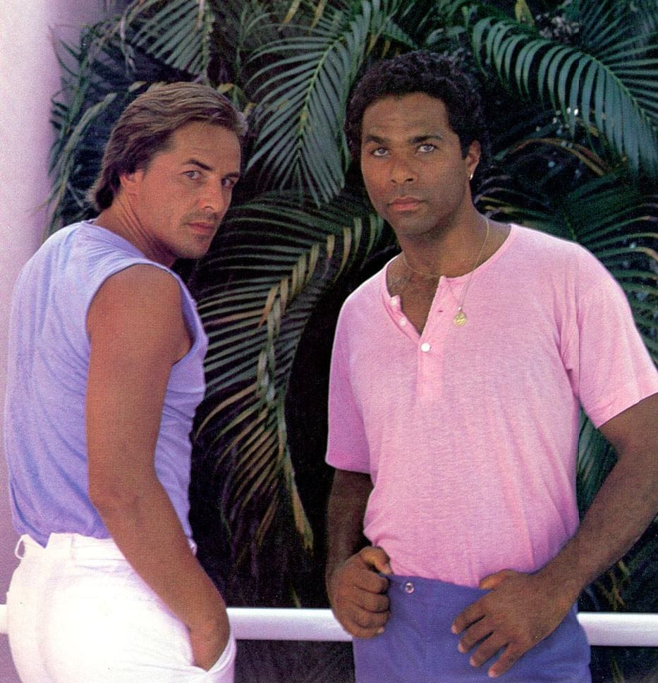 Afro American man and Caucasian man posing in pastel menswear