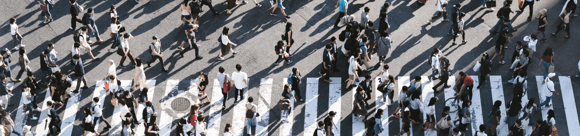 Top view of a crowd crossing a cross walk