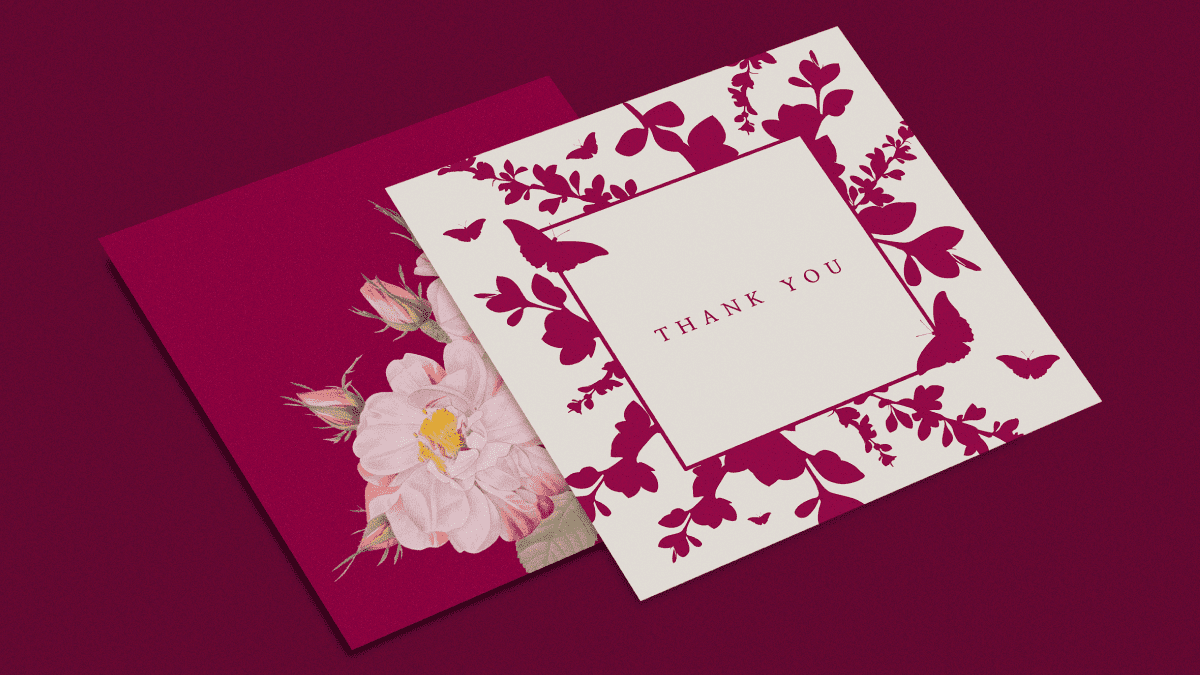 Two cards with flowers on a dark pink background