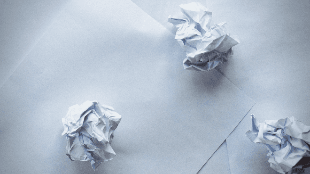 Crumpled white paper on white background 